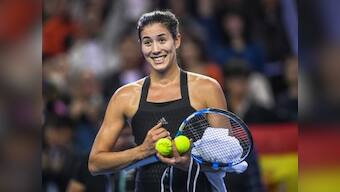 WTA Elite Trophy: Garbine Muguruza saves three match points against Anastasija Sevastova to reach semi-finals