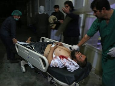 Kabul: A man injured in a suicide bombing is brought into a hospital in Kabul. AP