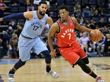 Toronto Raptors guard Kyle Lowry (7) controls the ball against Memphis Grizzlies guard Garrett Temple (17) in the first half of an NBA basketball game, Tuesday, Nov. 27, 2018, in Memphis, Tenn. (AP Photo/Brandon Dill)