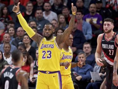 Los Angeles Lakers forward LeBron James, center, gestures against the Portland Trail Blazers during the first half of an NBA basketball game in Portland, Ore., Saturday, Nov. 3, 2018. (AP Photo/Craig Mitchelldyer)