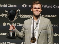 Norway's Magnus Carlsen retains World Chess Championship after tie-breaker