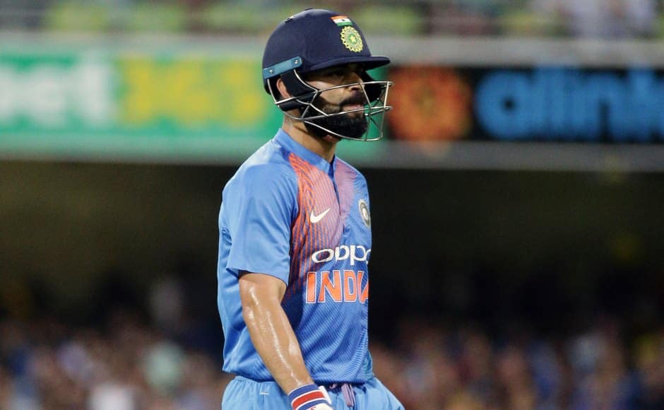 India’s Virat Kohli walks off after he lost his wicket during the first T20 International cricket match between Australia and India in Brisbane, Australia, Wednesday, Nov. 21, 2018. (AP Photo/Tertius Pickard)