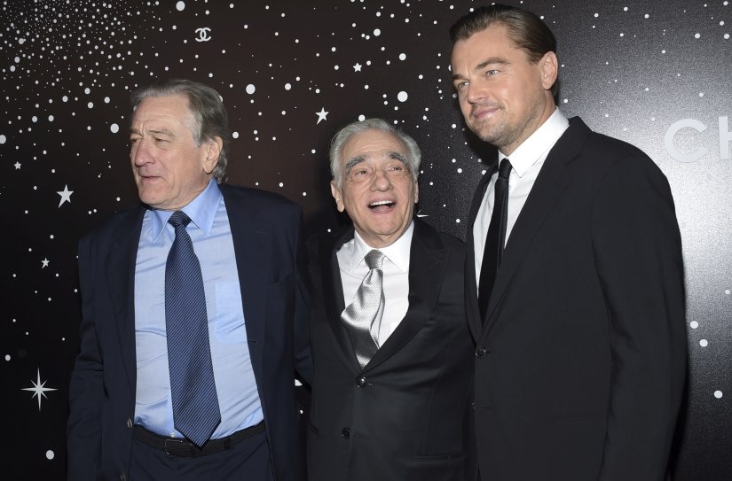 Honoree Martin Scorsese, center, poses with actors Robert De Niro, left, and Leonardo DiCaprio at the Museum of Modern Art Film Benefit tribute to Martin Scorsese, presented by Chanel, on Monday, Nov. 19, 2018, in New York. (Photo by Evan Agostini/Invision/AP)