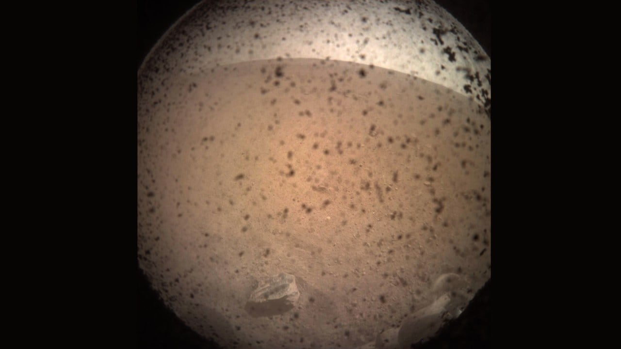 InSight acquired this image of the area in front of the lander using its lander-mounted Instrument Context Camera (ICC) hours after landing. Image courtesy: NASA