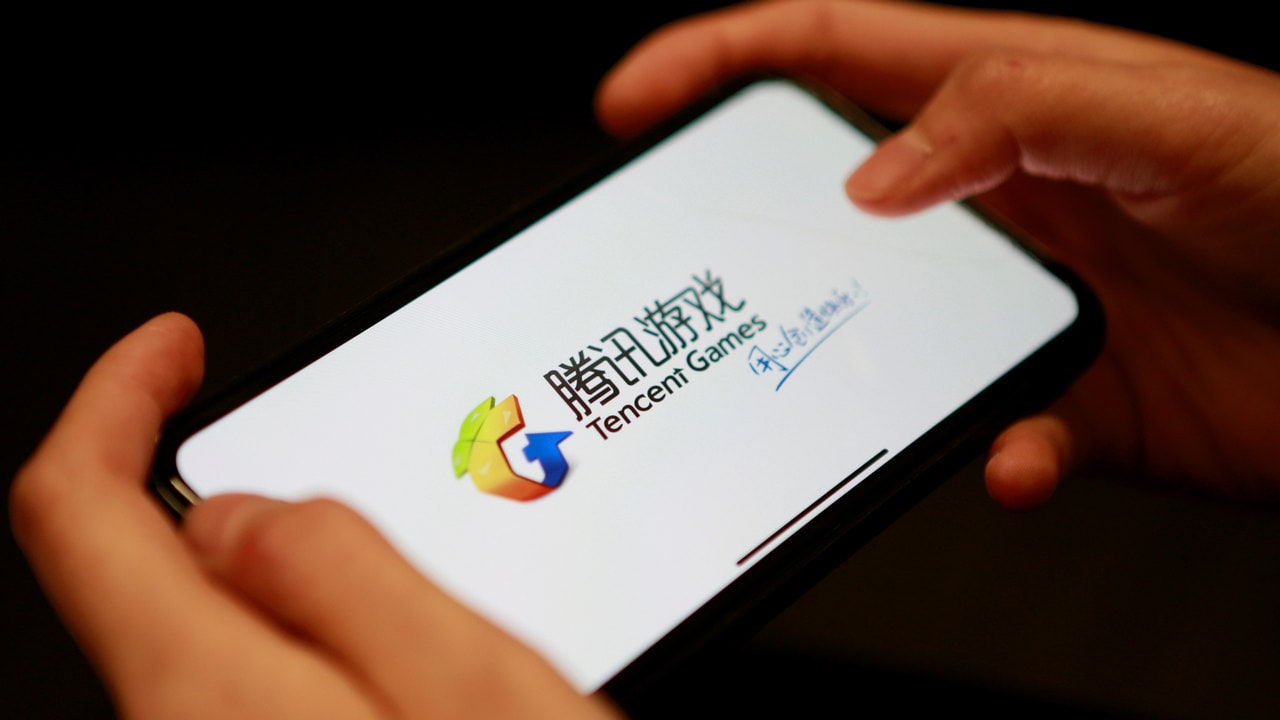 A Tencent Games logo from an app is seen on a mobile phone. Reuters