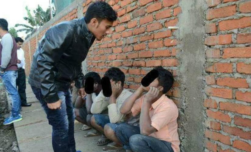 Workers caught by the students bodies. Image: Syeda Ambia Zahan