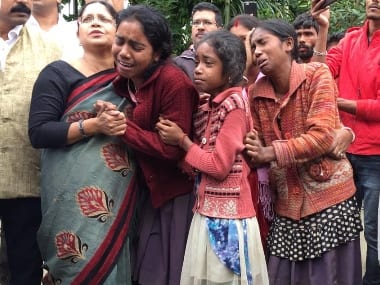 Trinamool Congress MP Mamata Thakur with the grieving families in Assam. Image courtesy: Twitter/@derekobrienmp