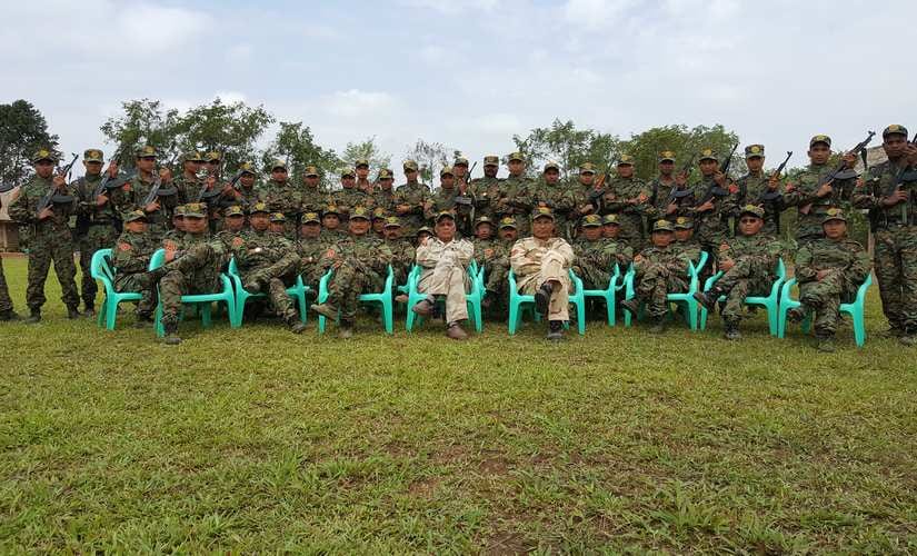   Paresh Baruah in a camp in Myanmar (fourth from left in the front row, sitting). Image: Sanjib Kumar Baruah 