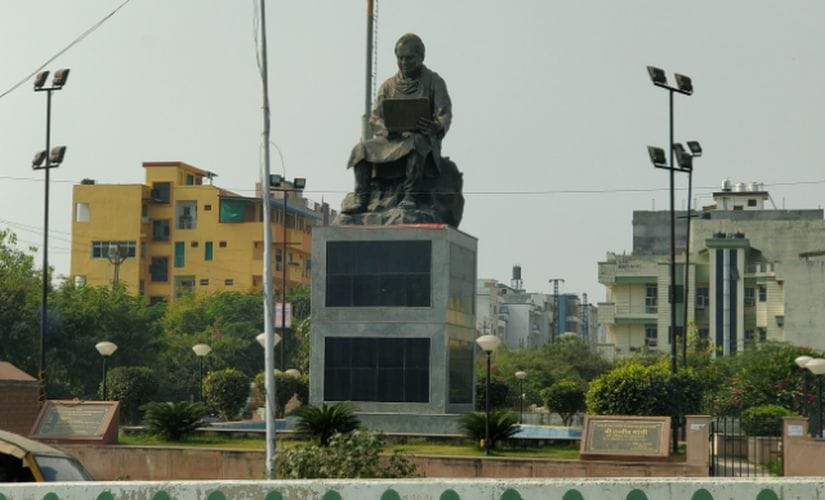   Upon entering Kota, we see a statue of Rajiv Gandhi sitting on a rock with a laptop. Image / Sandip Ghose / Firstpost 