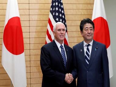 US Vice President Mike Pence shakes hands with Japanese Prime Minister Shinzo Abe. Reuters