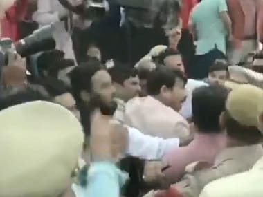 BJP leader Maoj Tiwari fights with AAP workers at the inauguration of the Signature Bridge in Delhi. ANI