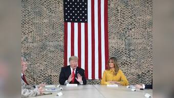 'It's time for us to start using our heads': Donald Trump defends Syria pullout during surprise visit to Iraq