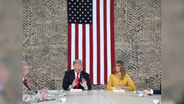 'It's time for us to start using our heads': Donald Trump defends Syria pullout during surprise visit to Iraq