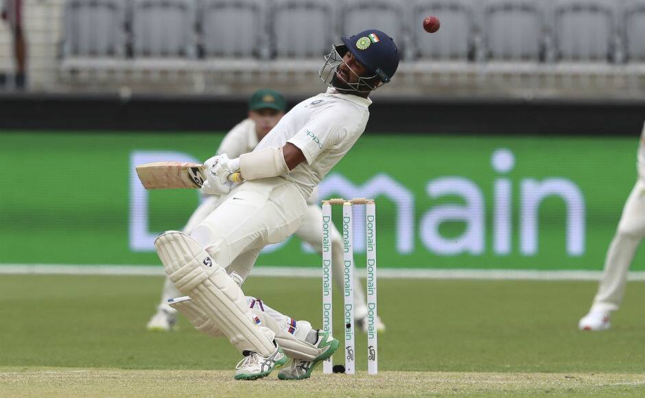 Cheteshwar Pujara ducks to a bouncer from Josh Hazlewood. AP