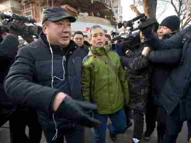 Supporters of Chinese human rights lawyer Wang Quanzhang were taken away by authorities. AP