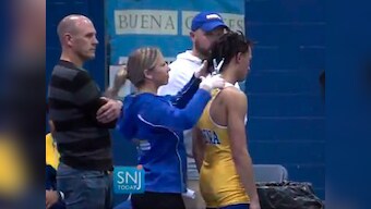 High school referee who ordered black wrestler to cut dreadlocks before bout suspended after online backlash
