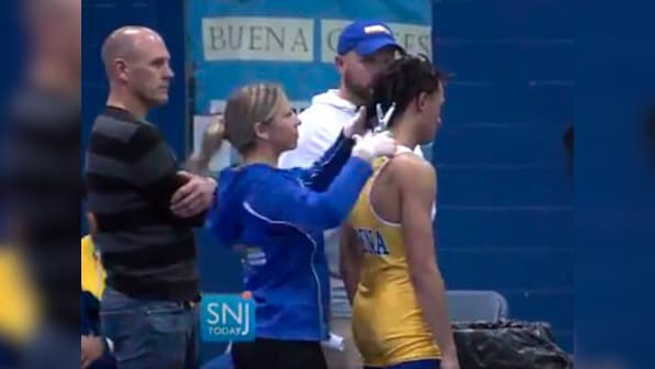 High school referee who ordered black wrestler to cut dreadlocks before bout suspended after online backlash