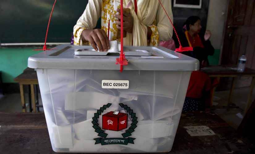 A Bangladeshi woman casts her vote at a polling station in the ancient city of Panam Nagar, about 20 kilometers southeast of Dhaka. AP