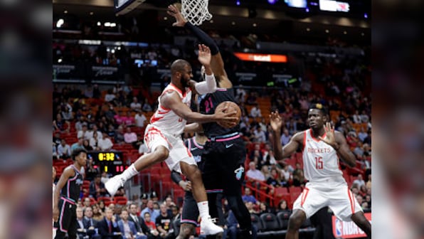 NBA: Chris Paul goes off injured in Rockets' loss to Heat; Clippers beat Mavericks to end four-game losing streak