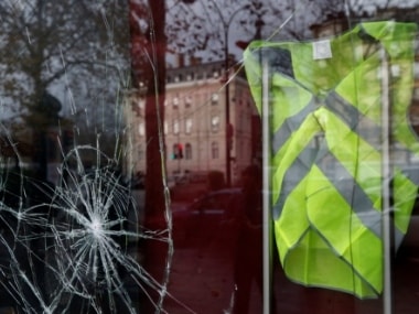 A yellow vest hanged inside a vandalized store on Sunday morning after clashes with protesters wearing yellow vests, a symbol of a French drivers' protest against higher diesel fuel taxes, in Paris, France. Reuters