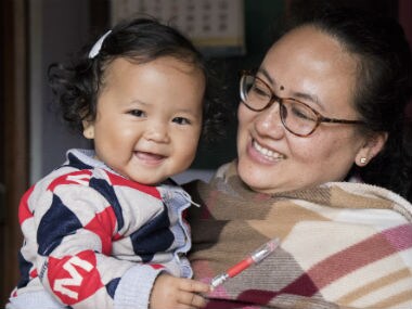 Kishorechand Wangkhem's wife Ranjita Elangbam with her daughter. Image courtesy: Sunzu Bachaspatimayum