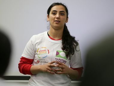 Former Afghanistan women's football captain Khalida Popal speaks during a motivational session with young women in south London on March 30, 2018. - Former Afghanistan women's football captain Khalida Popal fled her country after receiving death threats but it has far from cowed her in fighting the prejudice which confronts women daily, she told AFP. The 30-year-old -- who has been based in Denmark since 2011 -- takes her message round the world and spoke after giving an inspirational talk to the girls of Team England who will compete in the Street Child World Cup in Moscow later this year. Popal said women could achieve anything, a belief she formed when as a child a group of men refused to give back the football she was playing with, saying girls had no right to take part in sport. (Photo by Daniel LEAL-OLIVAS / AFP)