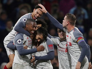 Soccer Football - Premier League - Burnley v Liverpool - Turf Moor, Burnley, Britain - December 5, 2018 Liverpool's Roberto Firmino celebrates scoring their second goal with team mates REUTERS/Scott Heppell EDITORIAL USE ONLY. No use with unauthorized audio, video, data, fixture lists, club/league logos or "live" services. Online in-match use limited to 75 images, no video emulation. No use in betting, games or single club/league/player publications. Please contact your account representative for further details. - RC15F33865F0