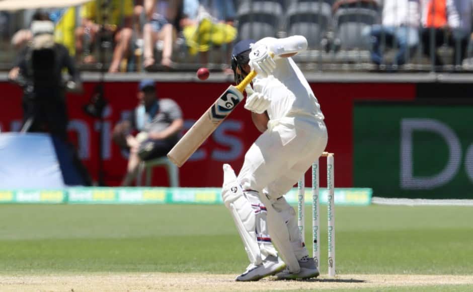 Umesh Yadav is struck by a vicious bouncer from Mitchell Starc. AP