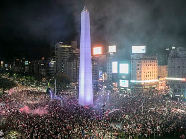 Fans of River Plate celebrate their team's Copa Libertadores win at the Plaza de la Republica, Buenos Aires. AFP