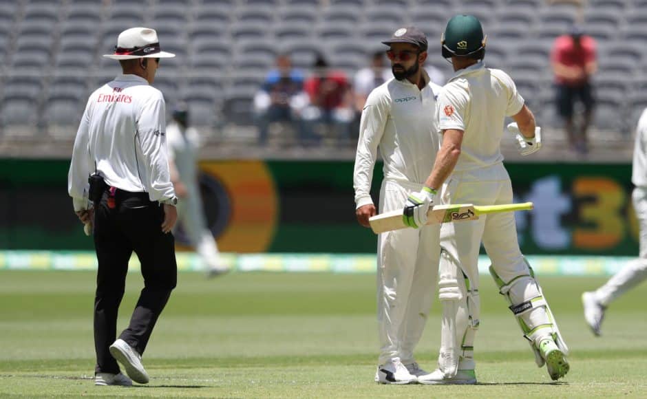 Virat Kohli and Tim Paine were seen exchanging words after the Indian captain almost collided with the Australian skipper on the pitch. AP