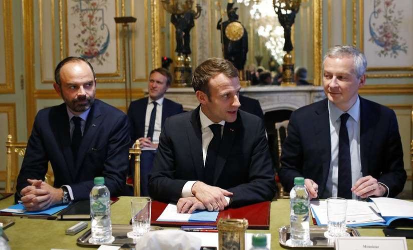 France's President Emmanuel Macron, (centre) attend a meeting with the representatives of the banking sector at the Elysee Palace, in Paris. AP