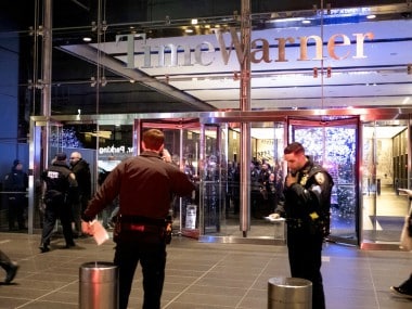 New York City police officers stand by at the Time Warner Center as people reenter the lobby in New York. AP
