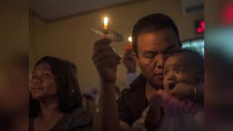 Traumatised by sudden tsunami, that killed 429 in Indonesia, survivors remain jittery; Christmas celebrations replaced by sombre prayers