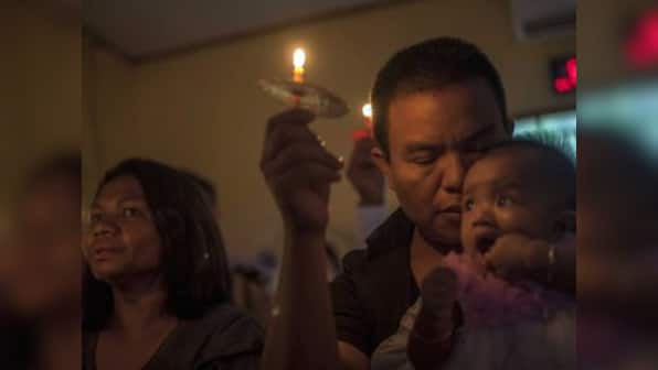 Traumatised by sudden tsunami, that killed 429 in Indonesia, survivors remain jittery; Christmas celebrations replaced by sombre prayers