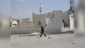 Toll in bomb blast at Somalia's Mogadishu rises to 20; president condemns attacks, PM visits wounded