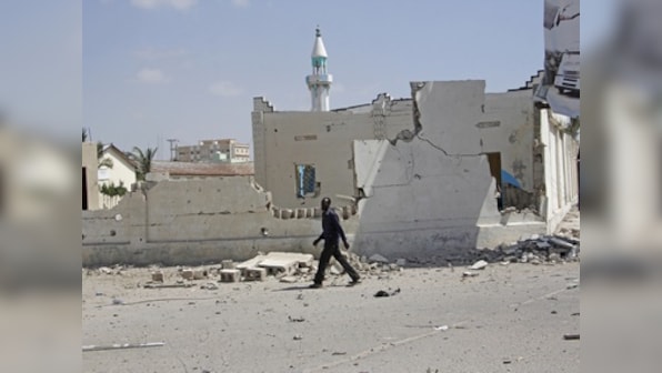 Toll in bomb blast at Somalia's Mogadishu rises to 20; president condemns attacks, PM visits wounded