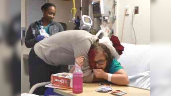 Barack Obama fills in for Santa Claus in Washington, surprises sick children with gifts at Children's National hospital