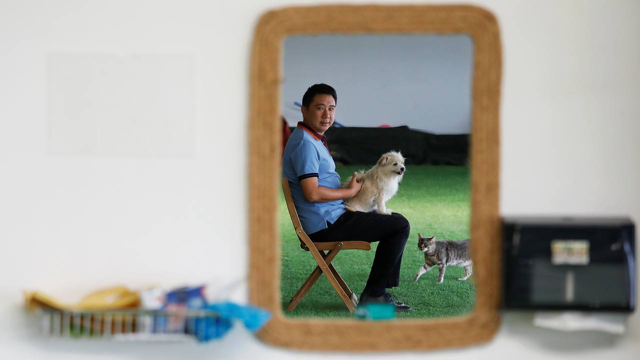 Owner He Jun poses with his dog Juice at his pet resort in Beijing, China June 7, 2018. Picture taken June 7, 2018. REUTERS/Damir Sagolj