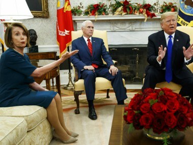 Vice President Mike Pence, looks on as House Minority Leader Rep. Nancy Pelosi argues with President Donald Trump. AP