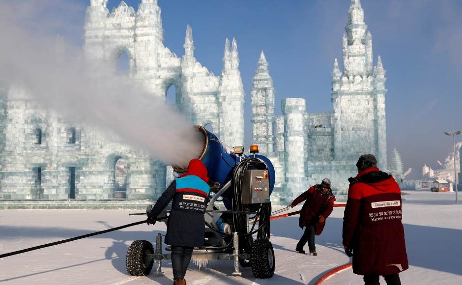 Visitors marvel at the mini ice replicas of the Colosseum and of the Milan Cathedral, particularly in the long evenings when soft, colored lights illuminate the ice sculptures. The image shows a snowmaking machine spraying artificial snow in front of the sculptures. Reuters Visitors marvel at the mini ice replicas of the Colosseum and of the Milan Cathedral, particularly in the long evenings when soft, colored lights illuminate the ice sculptures. The image shows a snowmaking machine spraying artificial snow in front of the sculptures. Reuters