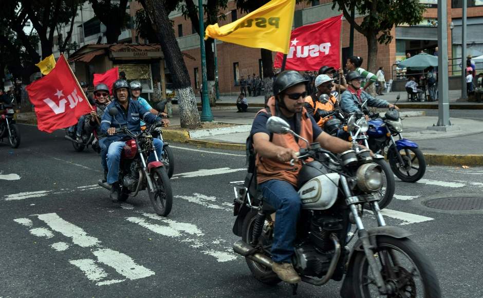 While anti-government supporters took to streets of Caracas to protest against the president, supporters of Maduro known as 'Colectivos', paraded in on motorbikes. AP While anti-government supporters took to streets of Caracas to protest against the president, supporters of Maduro known as 'Colectivos', paraded in on motorbikes. AP