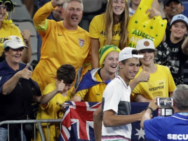 Australia's Alexei Popyrin poses for a photo with fans after defeating Austria's Dominic Thiem as he retired in their second round match. AP
