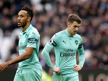 Arsenal's Aaron Ramsey and Pierre-Emerick Aubameyang, left, react during the English Premier League soccer match between West Ham United and Arsenal at London Stadium in London, Saturday, Jan. 12, 2019. (AP Photo/Tim Ireland)