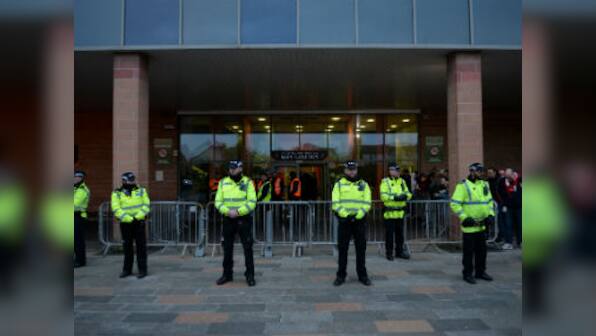 FA Cup: Blackpool fan stages protest against club owners on Arsenal's team bus roof before third-round tie