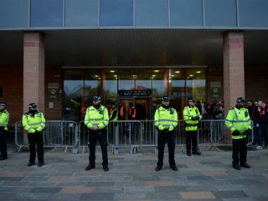 FA Cup: Blackpool fan stages protest against club owners on Arsenal's team bus roof before third-round tie