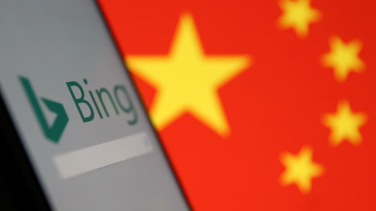 A smartphone with the Microsoft Bing logo is displayed against the backdrop of a Chinese flag. Reuters