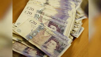 Pound stands firm after Theresa May's Brexit deal voted down by a crushing margin; PM's defeat factored in by market