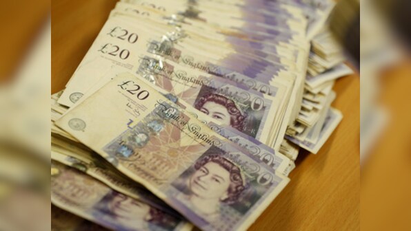 Pound stands firm after Theresa May's Brexit deal voted down by a crushing margin; PM's defeat factored in by market