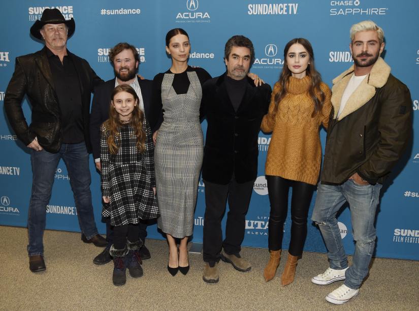 Joe Berlinger, third from right, director/producer of "Extremely Wicked, Shockingly Evil and Vile," poses with cast members, from left, James Hetfield, Haley Joel Osment, back, Morgan Pyle, front, Angela Sarafyan, Lily Collins and Zac Efron at the premiere of the film during the 2019 Sundance Film Festival, Saturday, Jan. 26, 2019, in Park City, Utah. (Photo by Chris Pizzello/Invision/AP)