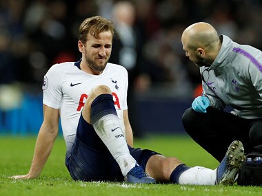 Soccer Football - Premier League - Tottenham Hotspur v Manchester United - Wembley Stadium, London, Britain - January 13, 2019 Tottenham's Harry Kane reacts as he receives treatment from the physio after sustaining an injury at the end of the match Action Images via Reuters/John Sibley EDITORIAL USE ONLY. No use with unauthorized audio, video, data, fixture lists, club/league logos or "live" services. Online in-match use limited to 75 images, no video emulation. No use in betting, games or single club/league/player publications. Please contact your account representative for further details. - RC18D6F549C0